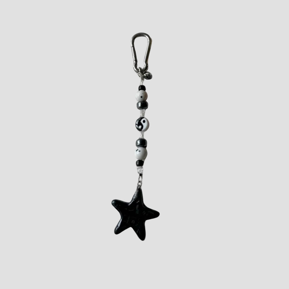 BLACK STAR CHARM